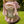 Child wearing a plush backpack with a bunny backapck on a grassy area